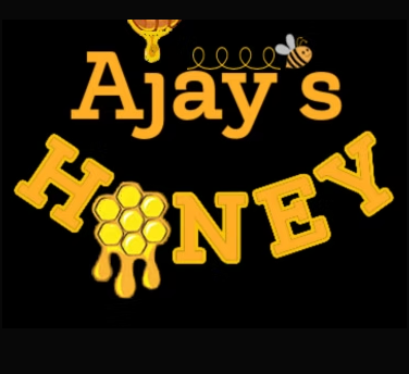 A decorative banner or sign reading 'Ajay's HONEY' in large yellow-orange lettering on a black background, with small bee and honeycomb illustrations.
