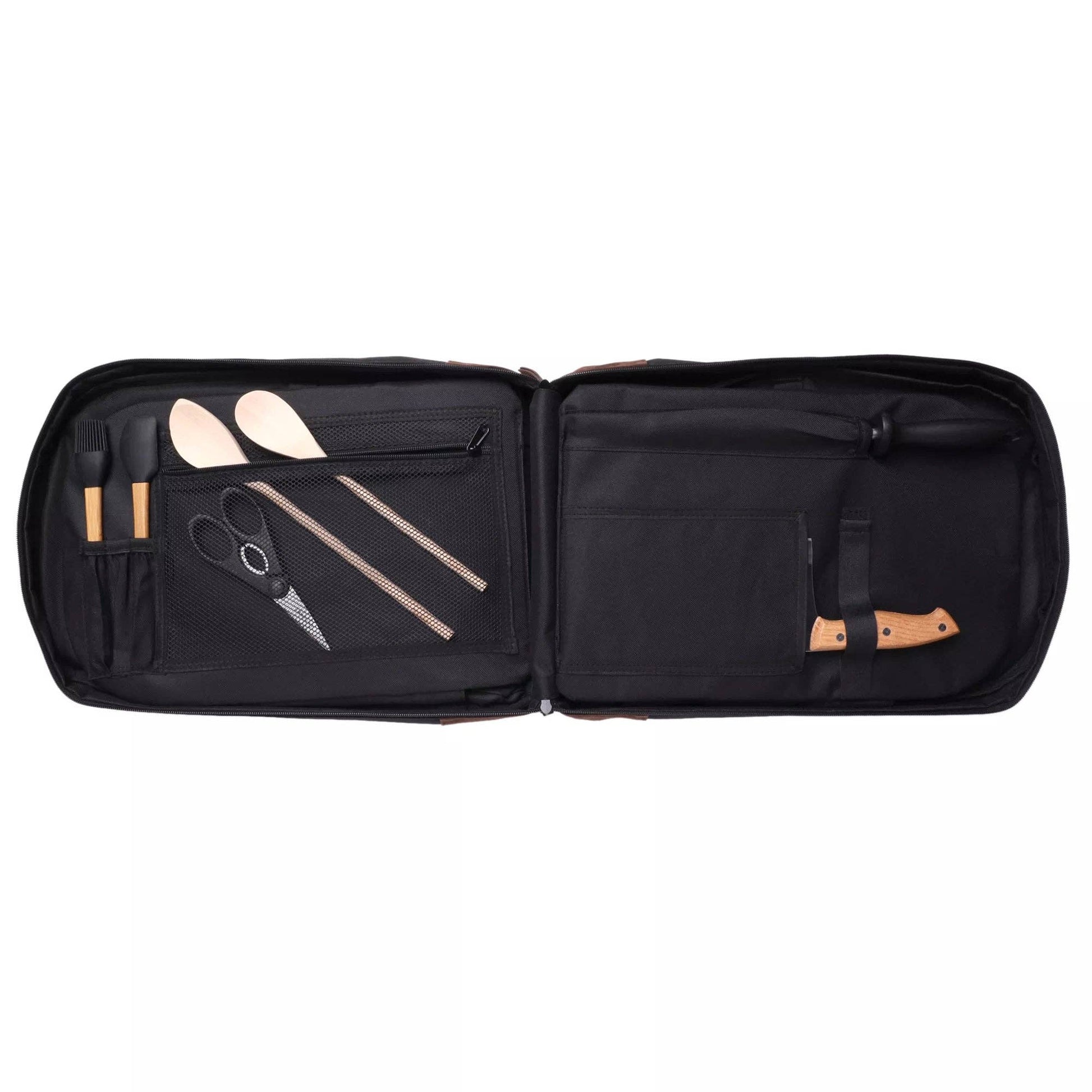 An open black carrying case displaying a set of barbecue tools, including wooden spatulas, metal scissors, and a knife with a tan handle, arranged neatly on a solid white background.
