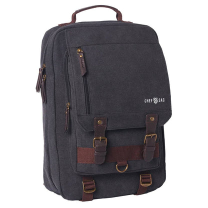 A dark gray canvas backpack with brown leather straps, buckles, and trim, featuring a white 'CHEF SAC' logo on the front pocket, shown on a plain white background.