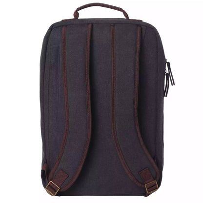 The back view of a dark gray canvas backpack with dark brown leather straps and trim, featuring brass-colored buckles, shown on a plain white background.
