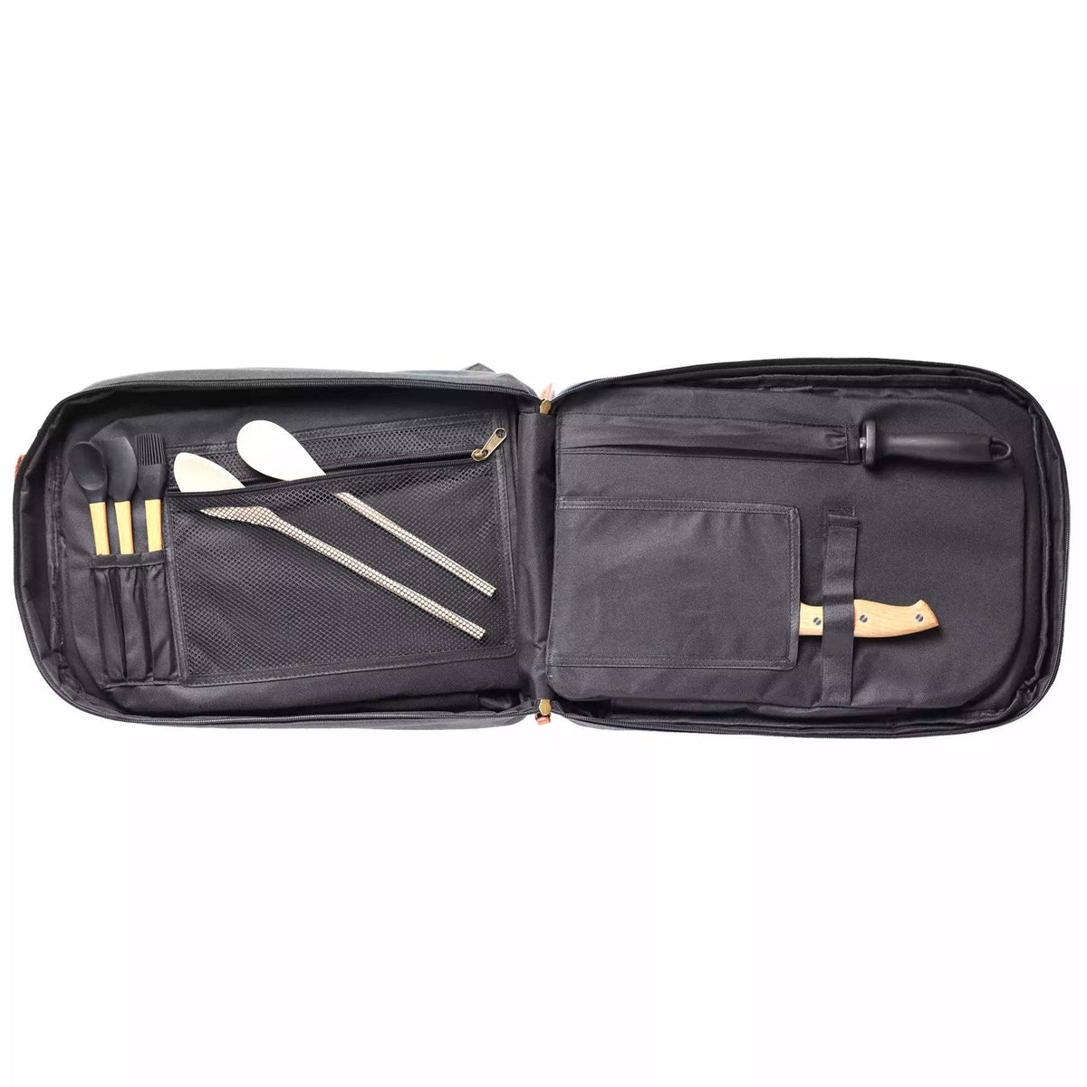 An open black nylon carrying case displaying its interior organization, which holds multiple stainless steel tools and utensils including spatulas, skewers, and a knife with a light wood handle.