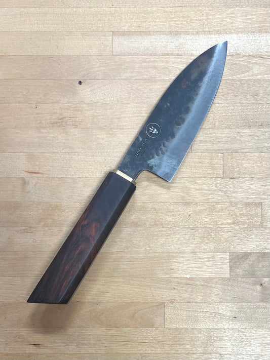 Dao Vua knife with a wooden handle on a cutting board