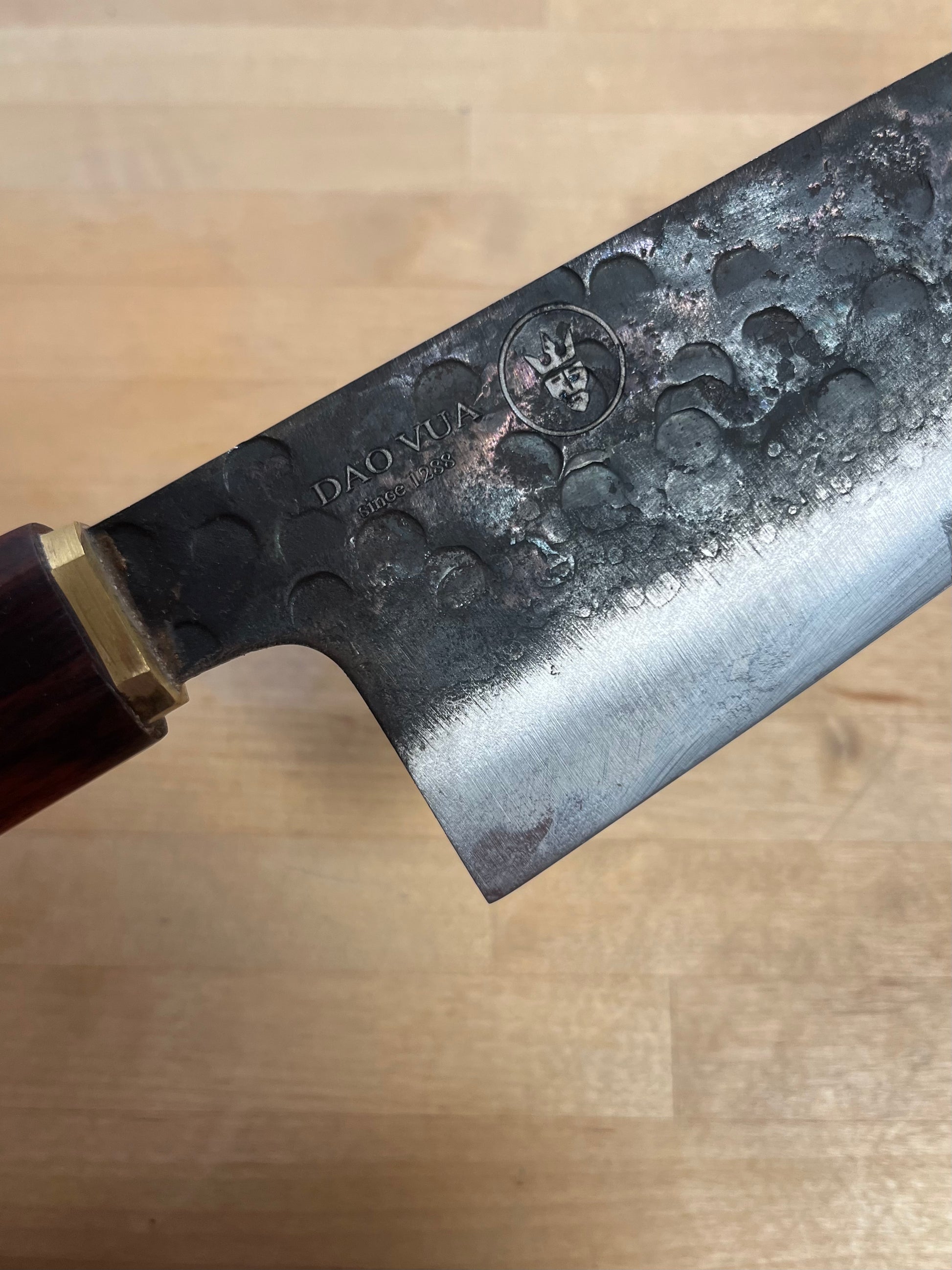 Close-up of a Do a Vua blade with a maker's mark brand 