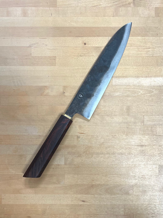 Dao Vua knife with a rosewood handle on a cutting board