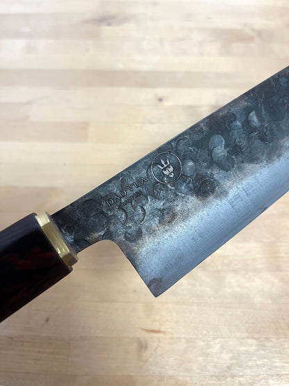 Close-up of a Dao Vua knife blade with a maker's mark brand 