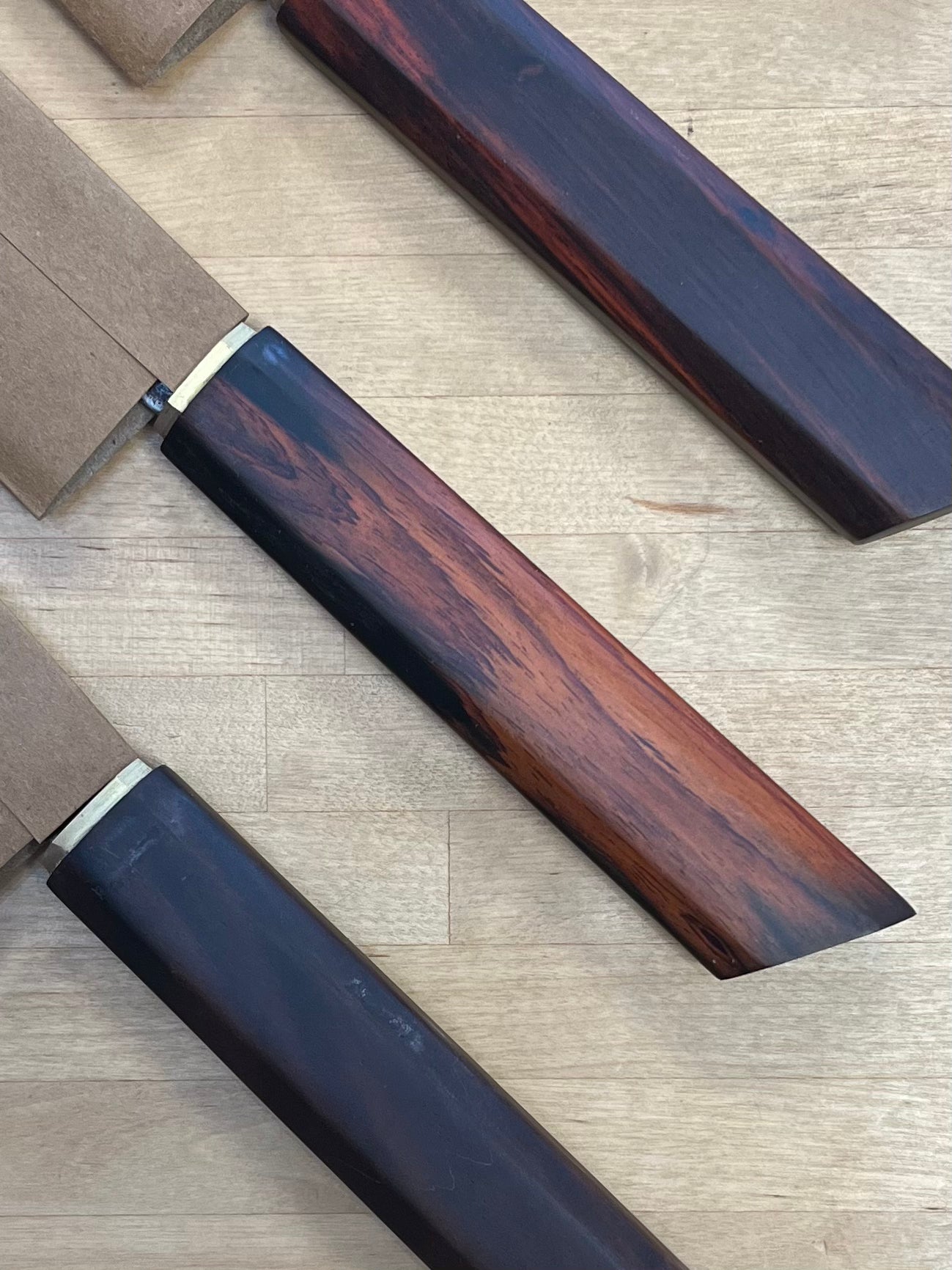 close up of Dao Vua knives rosewood handles