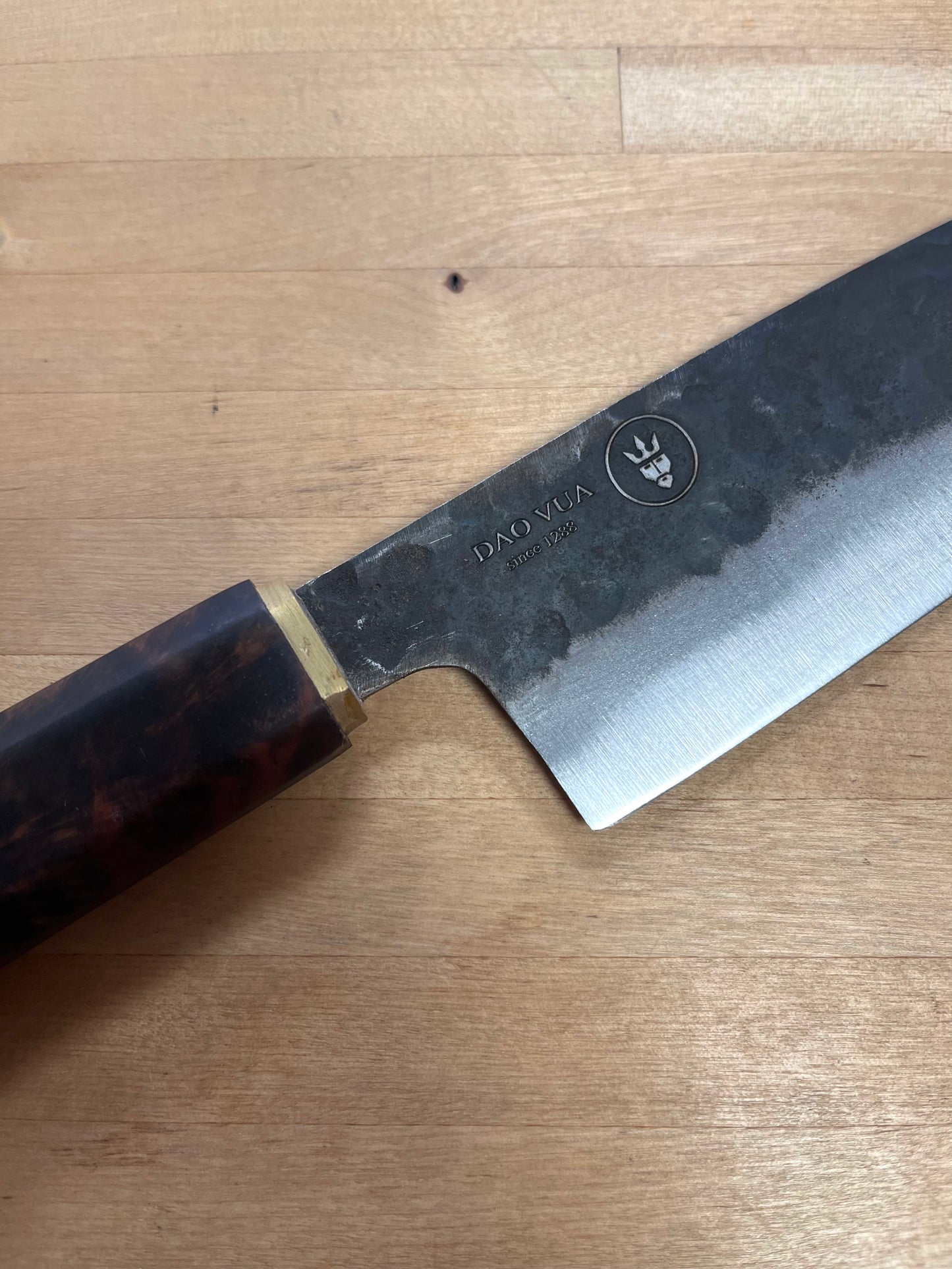 Close up of a Dao Vua knife with a maker's mark brand