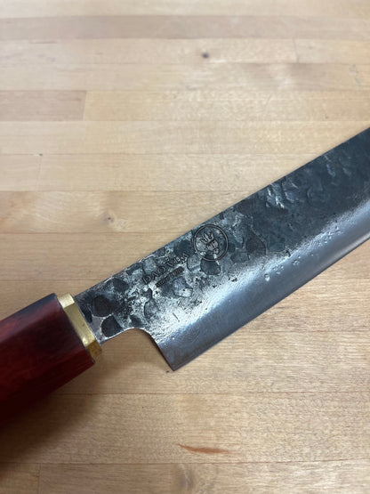 Close up of a Dao Vua knife with a maker's mark brand 
