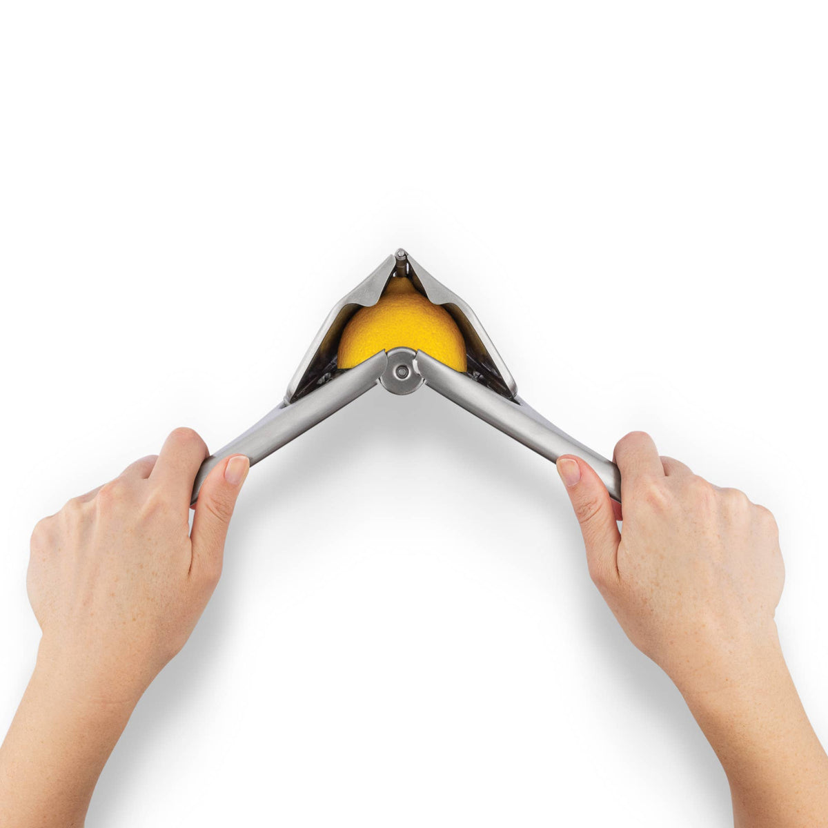Two hands using a Fluicer with a lemon inside.