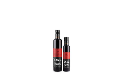 Two bottles of Balsamic Vinegar with red labels, one larger and one smaller, on a white background.