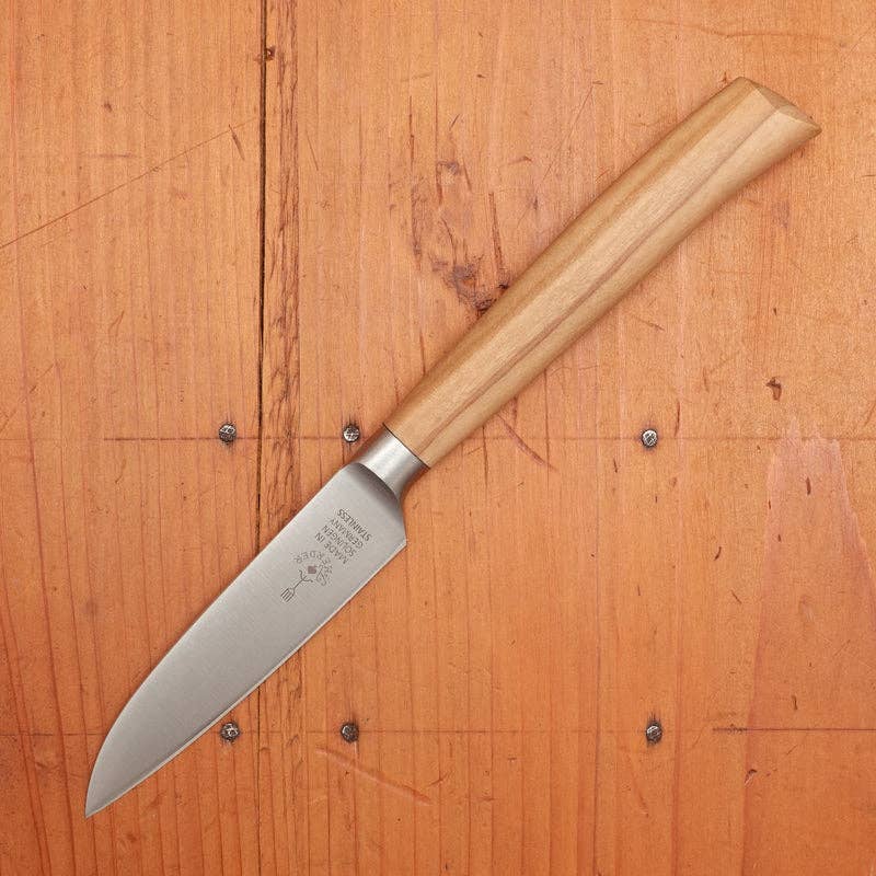 Knife with wooden handle on a wooden surface