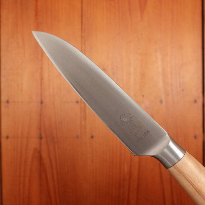 Knife with a wooden handle on a wooden background