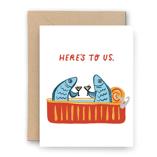 Greeting card with two fish in a bathtub, drinking cocktails, and 'Here's to Us' text.