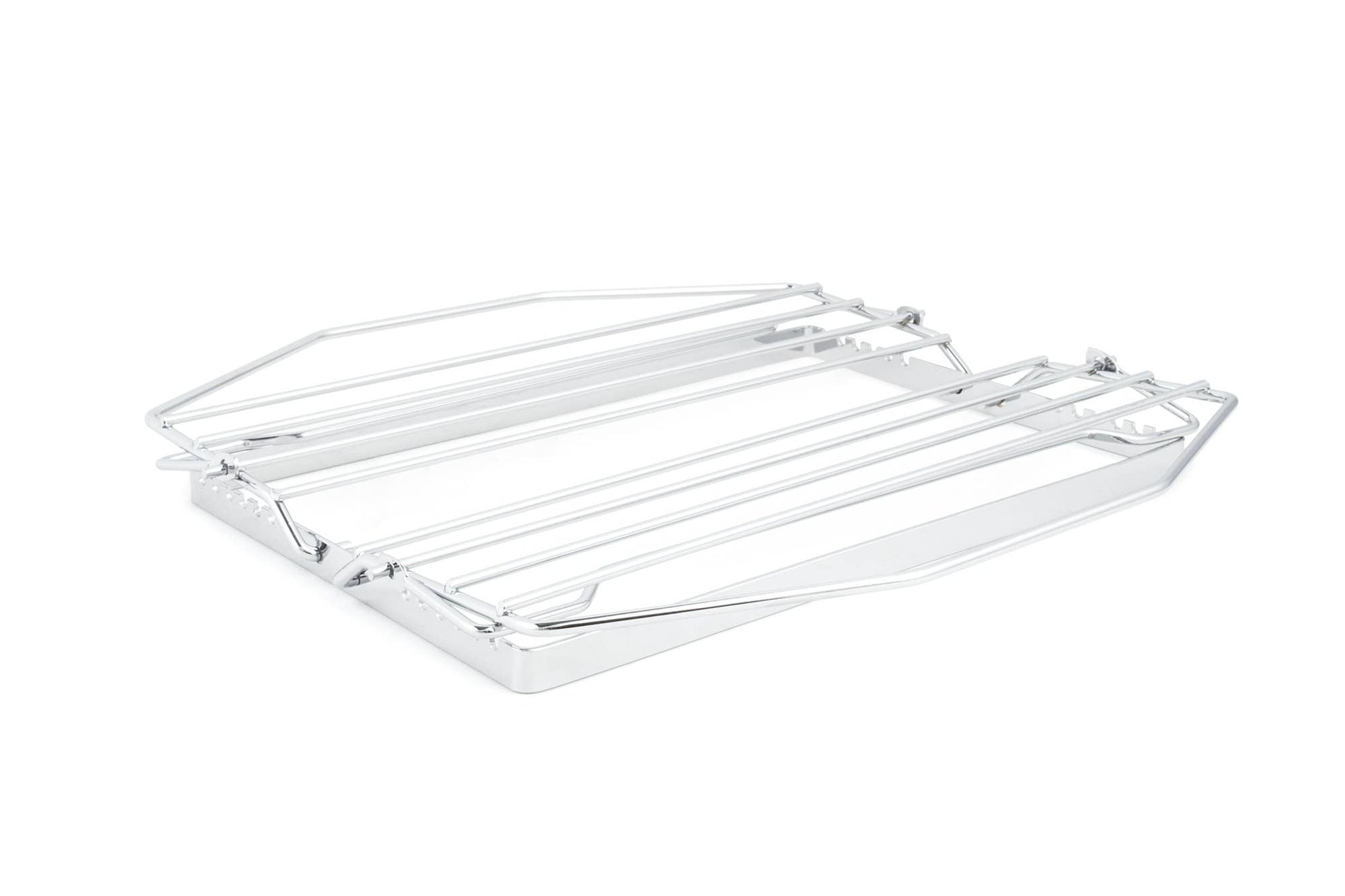 Chrome metal rack laying flat on a white background