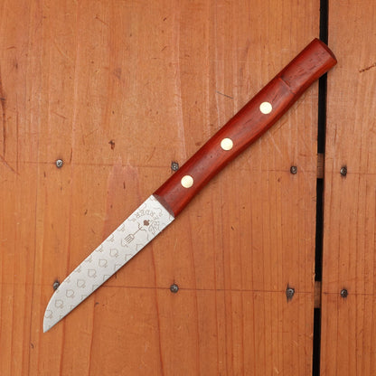 Knife with a wooden handle on a wooden surface