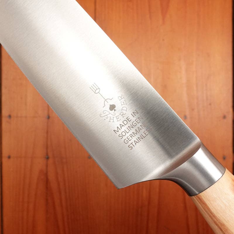 F. Herder stainless steel chef knife with olive wood handle, made in Germany.