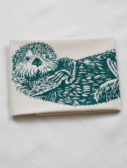Notebook with teal otter illustration on a white background