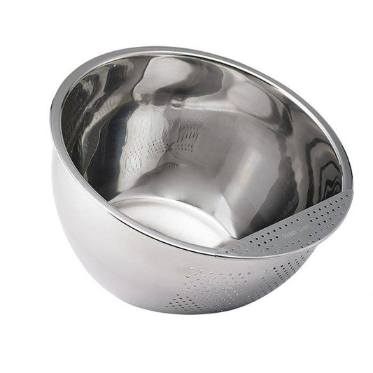 Stainless steel rice washing bowl with  perforated exterior on a white background
