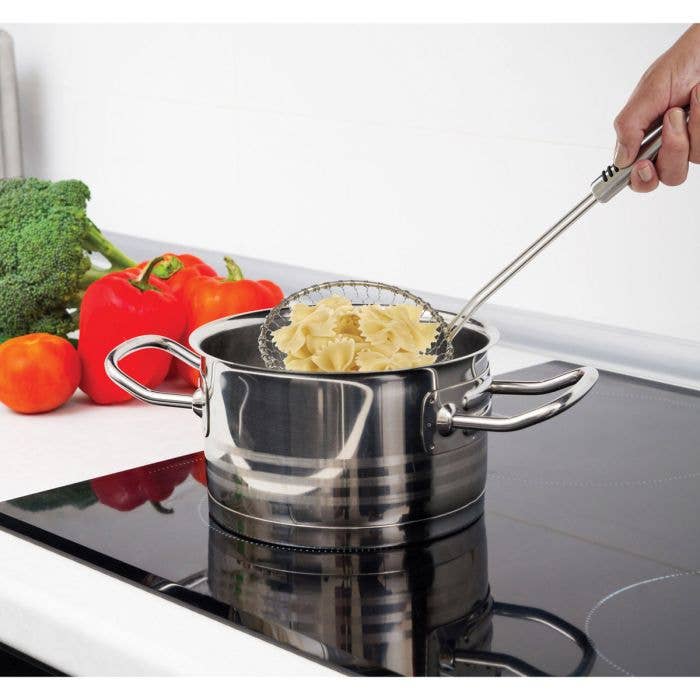 Stainless steel pot with pasta on a stove
