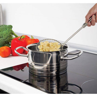 Stainless steel pot with pasta on a stove