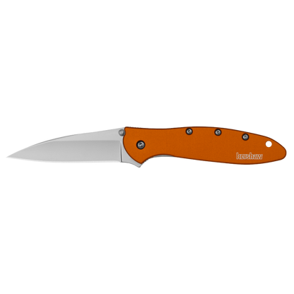 A folding pocket knife with a satin-finished silver blade and a textured orange handle, shown open against a solid white background. The brand name 'Kershaw' is clearly printed on the side of the handle.