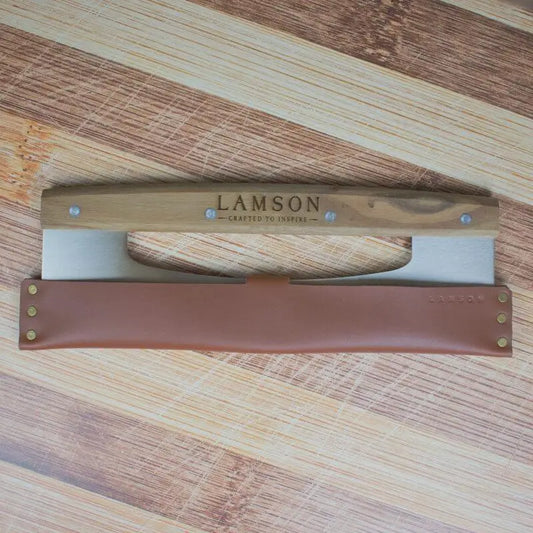 Lamson Rocker Cutter with leather sheath on butcher block.