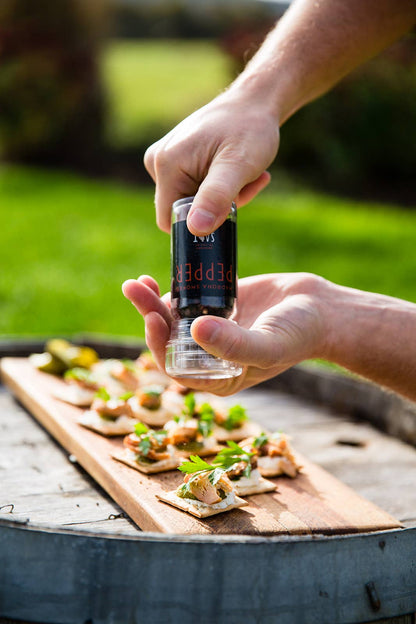 pepper grinding action shot