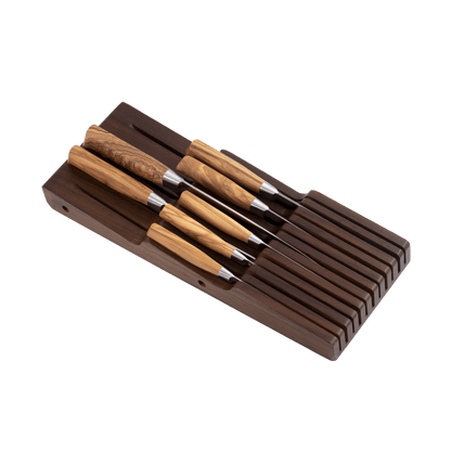 Set of knives with wooden handles in a brown wooden holder on a transparent background