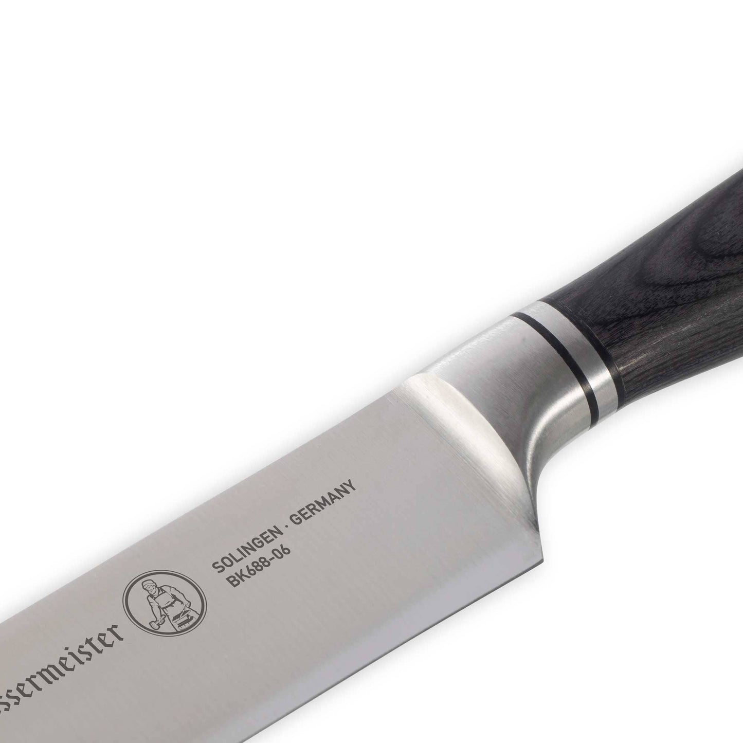 Knife blade with Messermeister branding on a white background