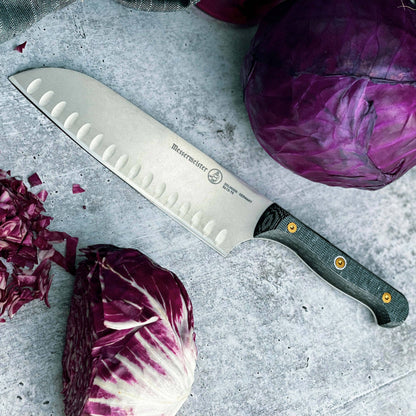 Messermeister Custom Santoku on grey surface with purple cabbage