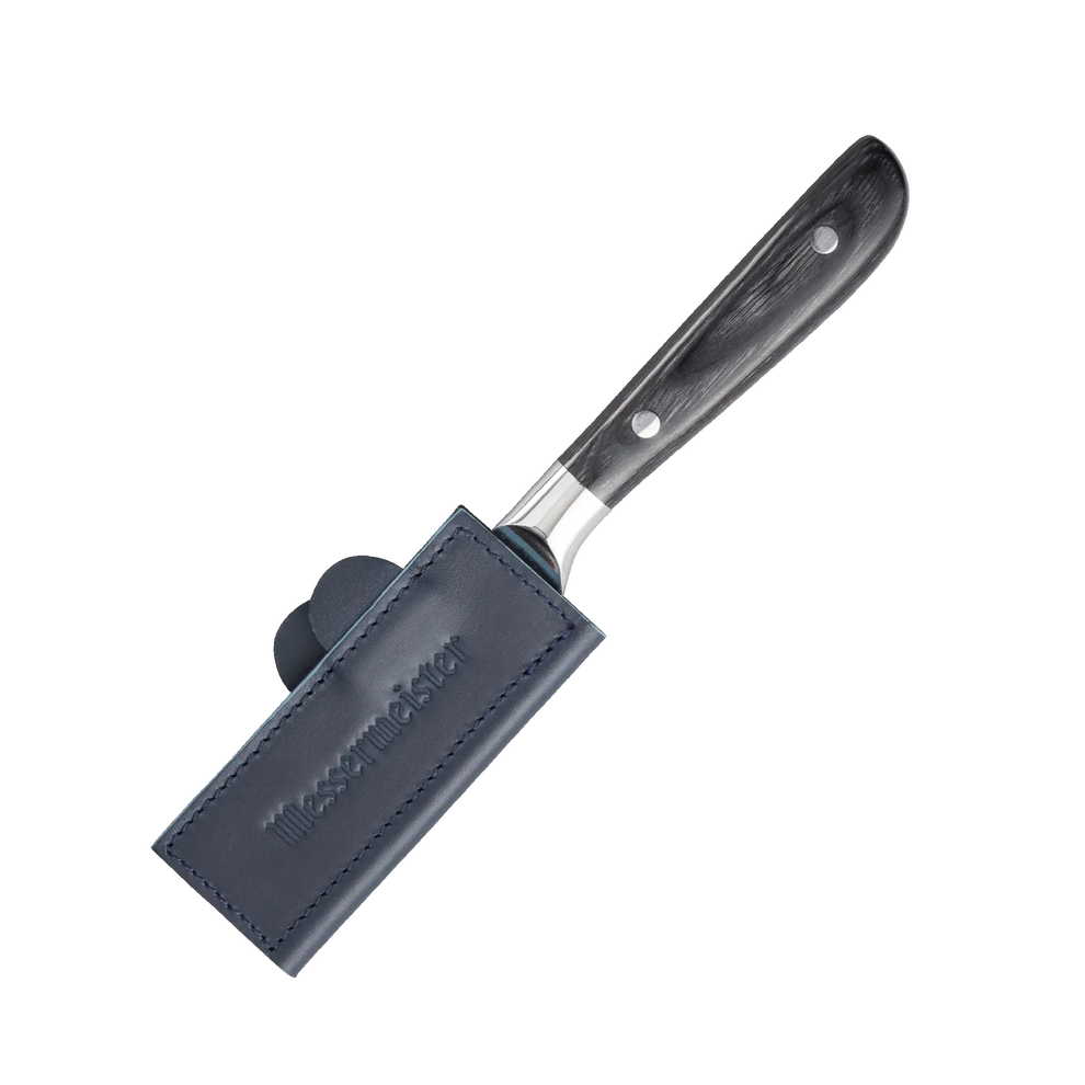 Knife with blue leather sheath on a white background