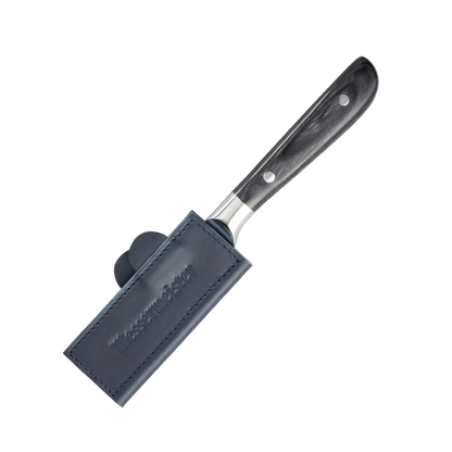 Knife with blue leather sheath on a white background