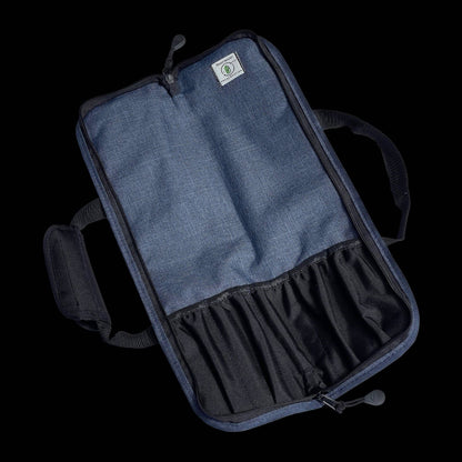 Opened blue knife bag with a visible brand Messermeister on a black background