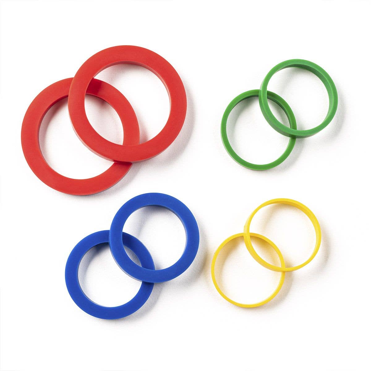 Set of red, blue, green, and yellow rolling pin rings on a white background.