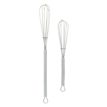 Two metal whisks  on a white background