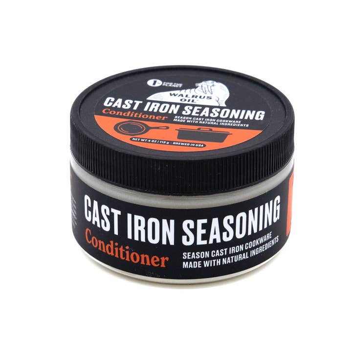 Jar of cast iron seasoning conditioner with black lid and label on a white background