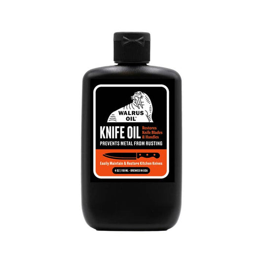 Black bottle of Walrus Oil Knife Oil on a white background