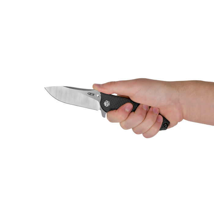 A hand holding a folding pocket knife with a satin-finished silver blade and a textured black handle, shown against a plain white background.